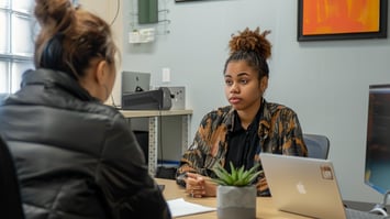 an interview in a small office with a person
