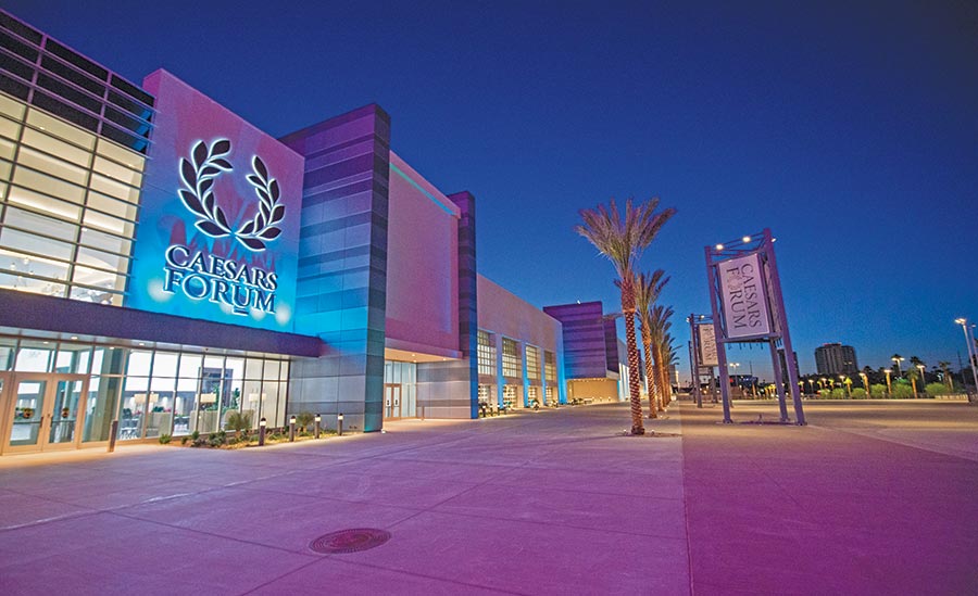 Caesars Forum convention center exterior at night in Las Vegas